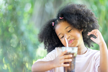 Children drink coca cola with food Childhood concepts and healthy eating.