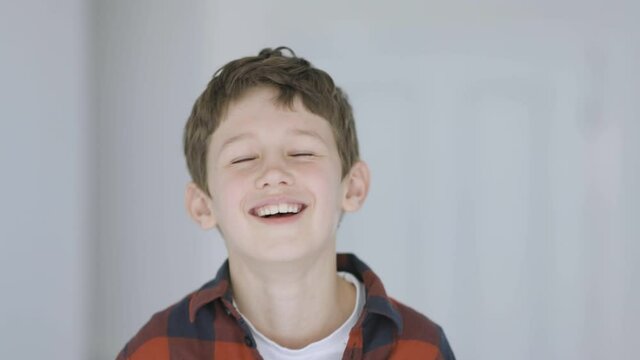 Cute little boy laughing heartily