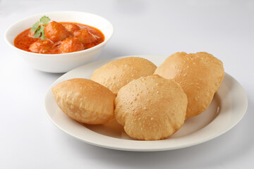 Indian food - Puri Bhaji. North India. Puri is a deep fried bread made from whole wheat flour & Served with Potato curry , bhaji or alu ki sabji.or Potato curry or dum alu curry
