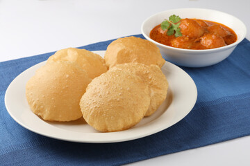 Indian food - Puri Bhaji. North India. Puri is a deep fried bread made from whole wheat flour & Served with Potato curry , bhaji or alu ki sabji.or Potato curry or dum alu curry
