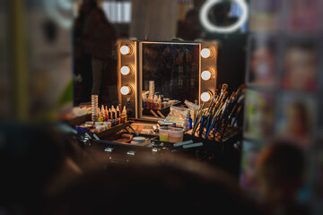 Make-up artist's workstation with a mirror and lights for backlighting