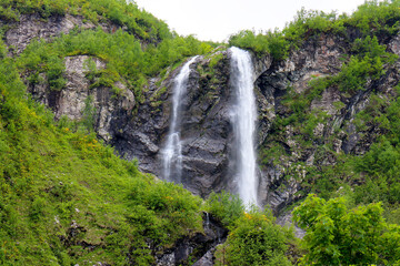 Polikarya Waterfall, located on the slope of Mount Aibga, in Krasnaya Polyana, Sochi. The height of the waterfall is 70 meters