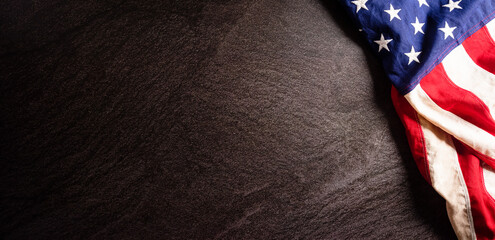 Happy Independence day: 4th of July, American flag on dark stone background with the text.