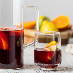 Glass with Sangria drink, famous Spanish summer beverage making with wine and fruit.