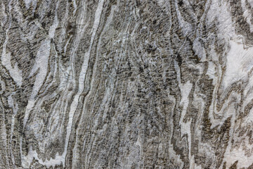 Abstract gray texture of natural, raw salt in an underground salt mine