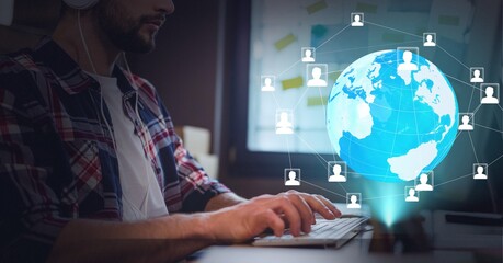 Network of profile icons over globe against mid section of man using computer at office