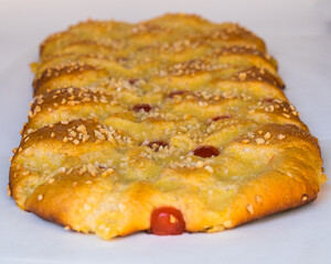 Coca de Sant Joan, a traditional sweet cake from Catalonia, Spain. It is eaten during Saint Johns Eve.