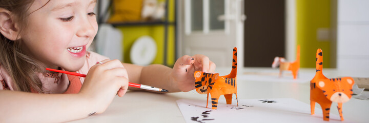 paper craft for kids. DIY tiger made from toilet paper sleeve for new year. create art for children
