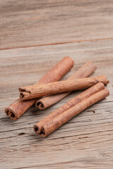 dried cinnamon sticks on wooden table with copy space