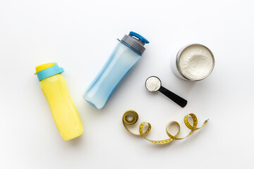 Sport nutrition - whey protein powder and shaker with protein smoothie