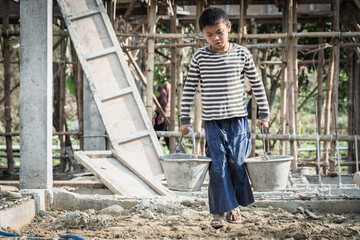 The concept of illegal child labor, Children are forced to work construction. Children violence and...