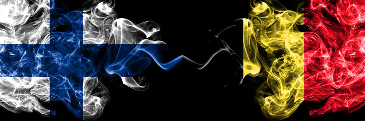Obraz premium Finland, Finnish vs Belgium, Belgian smoky flags side by side.