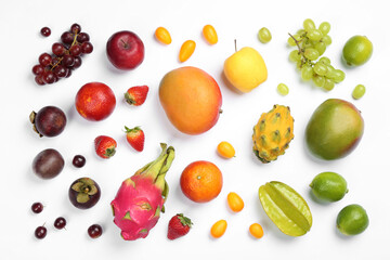 Many different delicious exotic fruits on white background, flat lay