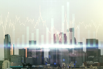 Fototapeta na wymiar Double exposure of abstract creative financial chart hologram on Los Angeles skyscrapers background, research and strategy concept