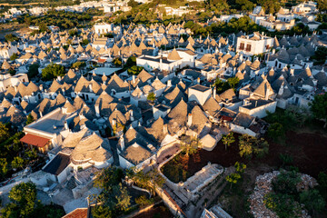 Aerial view of alberobello at sunset, the city of trulli in Puglia. a magical city and a beautiful...
