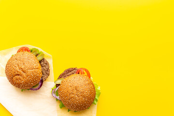 Sandwiches hamburger with chicken burger and green salad. Overhead view