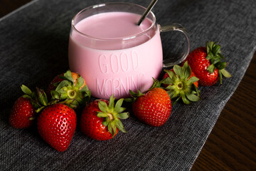 Warm strawberry milk with strawberries in the morning