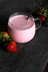 Warm strawberry milk with strawberries in the morning