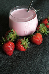 Warm strawberry milk with strawberries in the morning