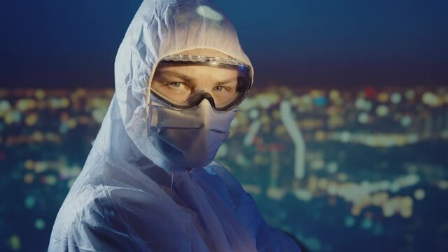 Doctor microbiologist scientist in a protective PPE suit
