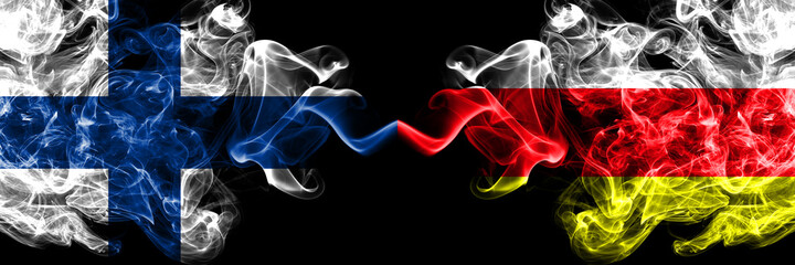 Finland, Finnish vs Russia, Russian, North Ossetia smoky flags side by side.