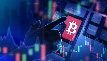 Bitcoin investing. Buying or selling cryptocurrency. Bitcoin logo keyboard. A trader buys cryptocurrency. Illustration on the topic of investing in bitcoin. Cryptocurrency trading.