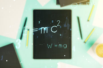 Creative scientific formula hologram and modern digital tablet on background, research concept....