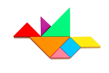 Color tangram puzzle in flying bird shape on white background