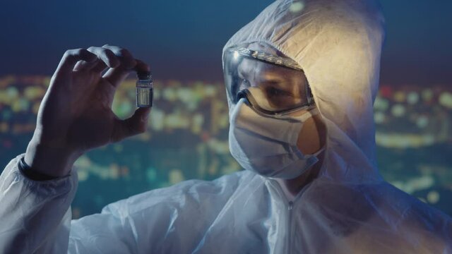 Doctor microbiologist scientist in a protective PPE suit