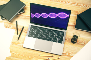 Modern computer monitor with creative DNA hologram. Bio Engineering and DNA Research concept. 3D Rendering