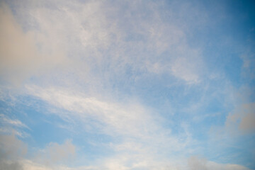 Naklejka na ściany i meble blue cloudy sky with white clouds in sunny weather, sky background