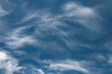 Beautiful blue sky background, white clouds covering thinly spread the sky