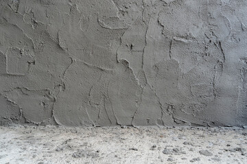 Texture of fresh rough unfinished concrete cement wall surface on construction site. Gray blank...