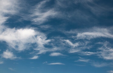 Beautiful blue sky background, white clouds covering thinly spread the sky