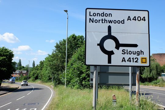 Road sign with directions for London Northwood A404 and Slough A412