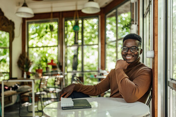 Adult man, starting his day at work with a smile.