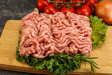 Raw pork minced meat over board