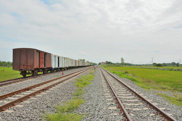 Fototapeta na wymiar Group of Old train bogies on rails with sky background