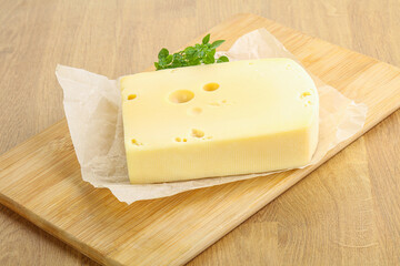 Maasdam cheese over the board