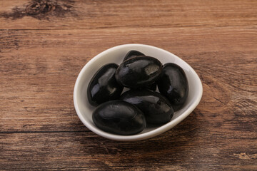 Pickled black olives in the bowl