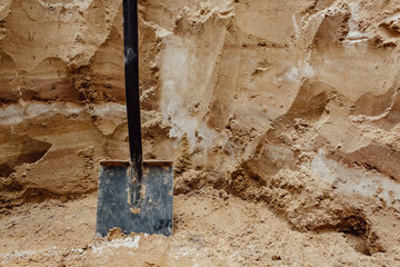 Layers of the earth. Shovel. Sand. Excavations.