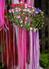 Many hung wreaths of flowers
