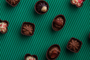 Top view flat lay various assorted chocolate candies.
