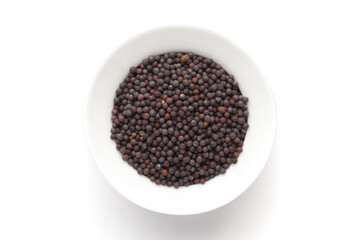Macro close-up of Organic Black mustard seed (Brassica nigra)  on white background. Pile of Indian...