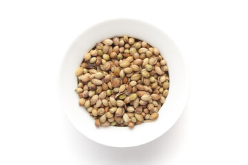 Macro close-up of Organic Coriander( Coriandrum sativum )  on white background. Pile of Indian Aromatic Spice. Top view