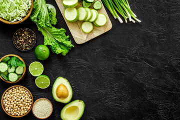 Cooking salad with green vegetables and chickpea in bowl