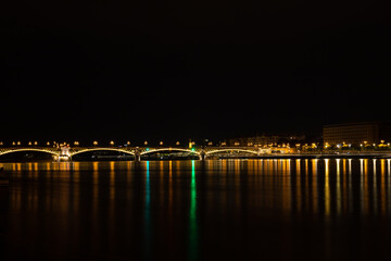 Night landscape with the lights of Budapest - Hungary reflected in the Danube water