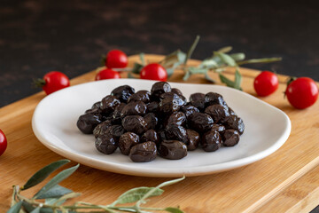 Black olive. Tasty black olives in the plate.