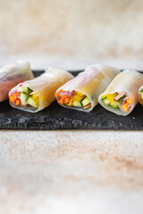 spring rolls Nem vegetables in rice paper organic dish on the table healthy food meal snack copy space food background rustic. top view keto or paleo diet veggie vegan or vegetarian food