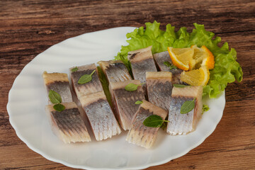 Herring fillet with sliced lemon